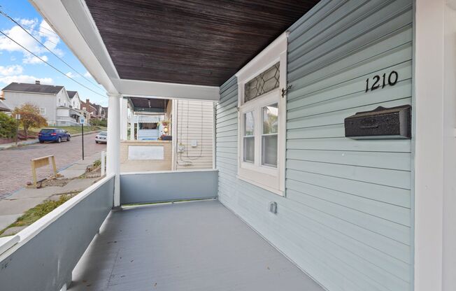 Newly updated with fresh paint, HUGE YARD, and NICE PORCH!