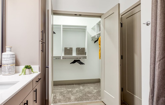 a bathroom with a shower and a sink and a mirror at Aura Stonebridge, Richmond Virginia