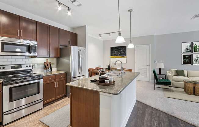 A modern kitchen with a stainless steel stove and refrigerator.