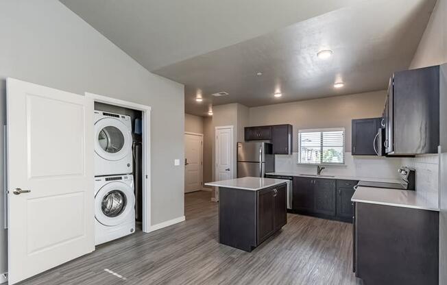 a kitchen with a washer and dryer