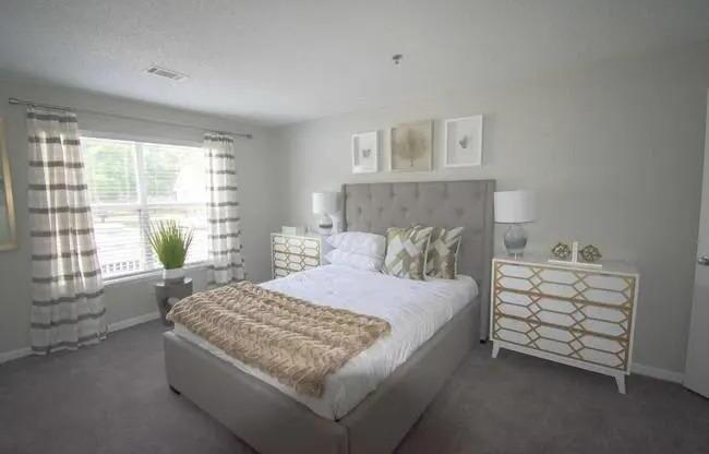 a white bedroom with a bed and a window at The Sapphire, Decatur, GA, 30035
