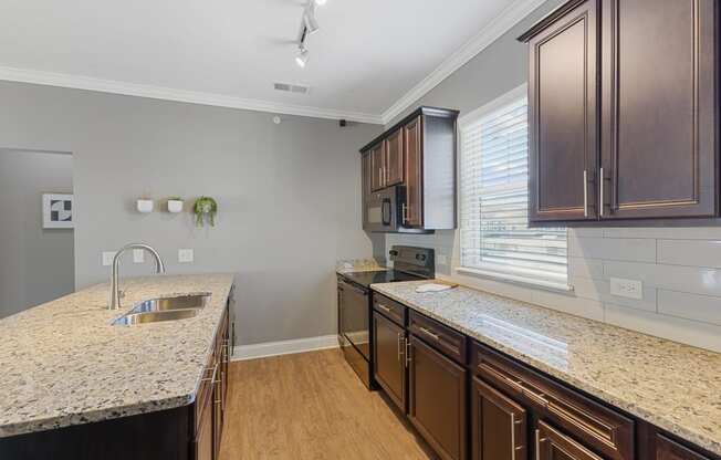 Large Kitchen With Granite Counters and Subway Tile BackSpash