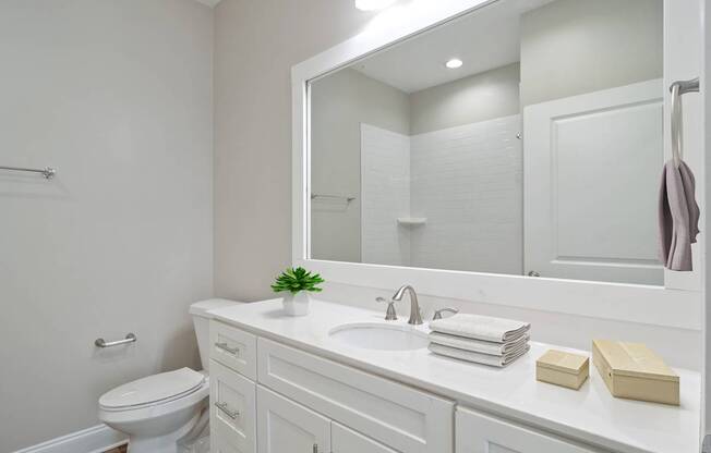 Bathroom with double vanity and modern lighting in Atlanta apartments for rent.