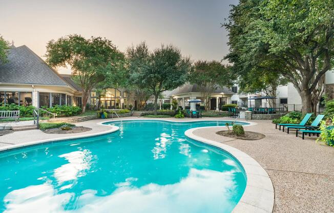 Surrounded by mature trees and thoughtful landscaping, the resort-style pool invites quiet moments or casual conversation poolside.