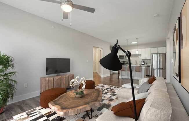 A modern living room with a wooden coffee table and a black floor lamp.