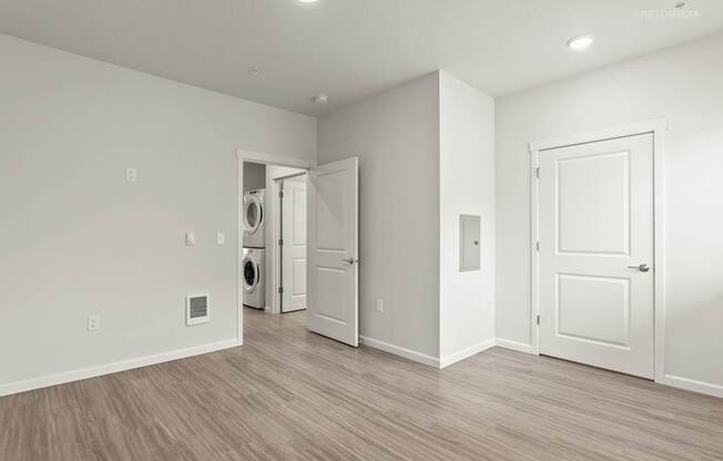 A room with a washer and dryer in it.