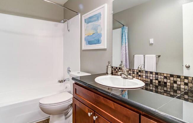 a bathroom with a sink toilet and bathtub at The Bluffs at Mountain Park, Oregon, 97035