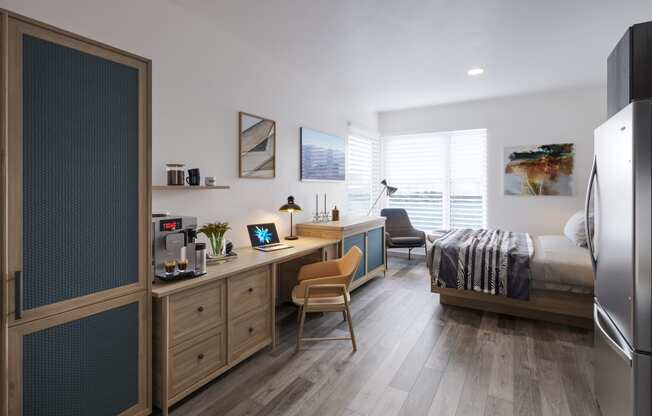 a bedroom with a bed and a desk in a room at Marina Square, Bremerton, WA, 98337