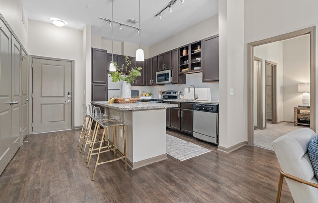 Open Living Room and Kitchen at RiverHouse Apartments in Little Rock, AR