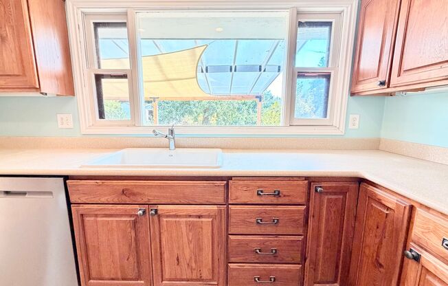 Charming Updated 1950s Home with Refinished Hardwoods & Large Fenced Yard – Landscaping Included!