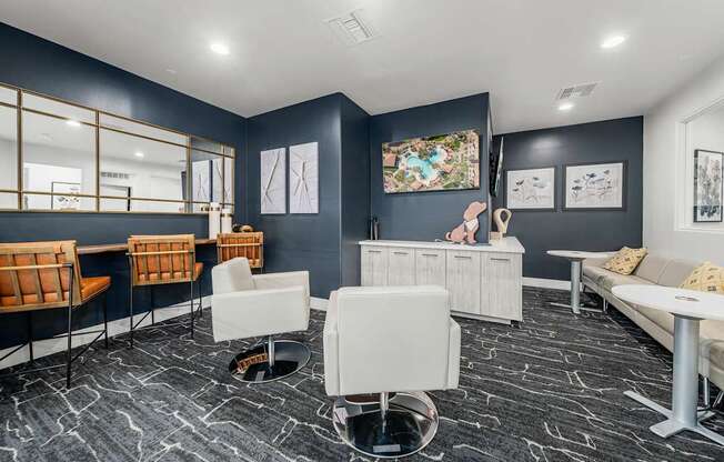 A room with a grey floor and white furniture.