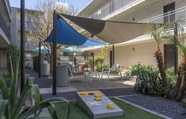 The Icon on Central Apartments in Phoenix, Arizona Patio with BBQ's and Corn Hole