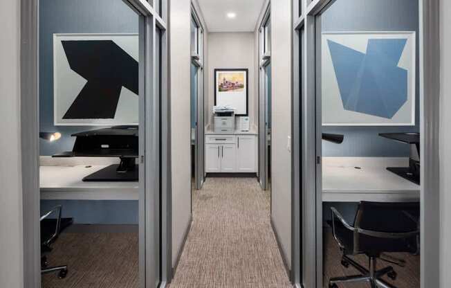 A hallway with two doors on either side leading to two different rooms.