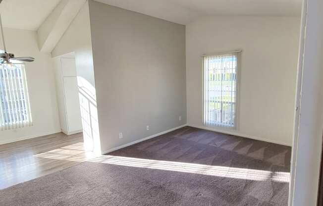 Enterance view of living room, dining room and adjacent kitchen at Northwood Apartments in Upland, California.