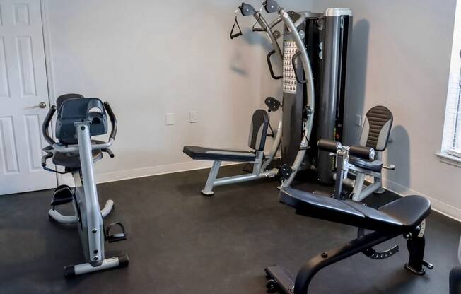 a gym with cardio equipment in a home gym