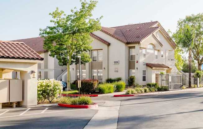 A row of houses with a red stripe on the side of the road.