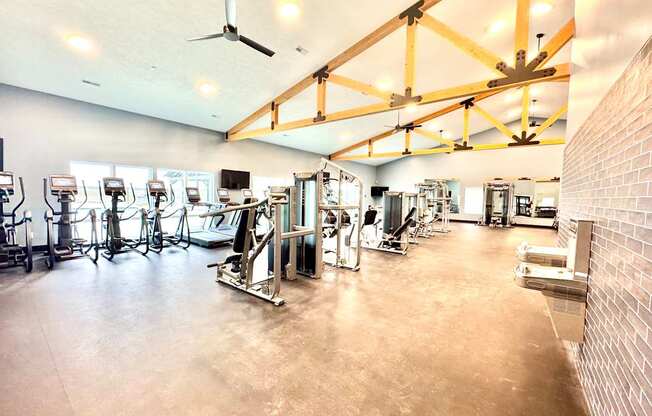 A gym with a variety of exercise equipment.