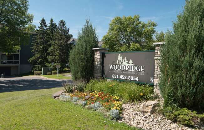 Outdoor sign that reads "Woodridge Apartments"