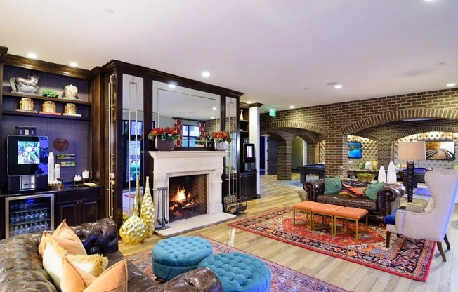 A living room with a fireplace and a large mirror on the wall.