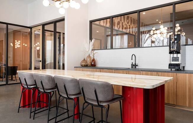 a kitchen with a long wooden table and chairs  at The Bohen Apartments , Minneapolis, 55408