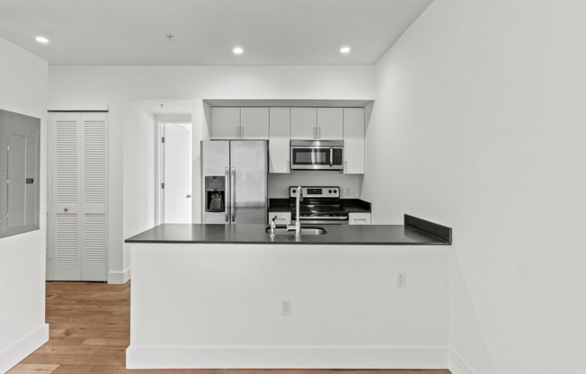 Experience culinary excellence in this spacious and contemporary kitchen.