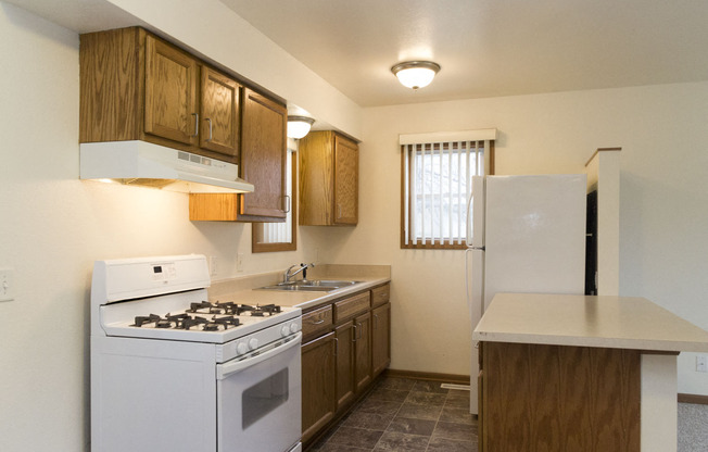 The kitchen in this Meredith Homes 3 bedroom apartment features a gas range and great counter space.