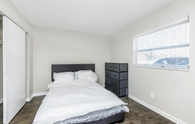 a bedroom with a large bed in a room