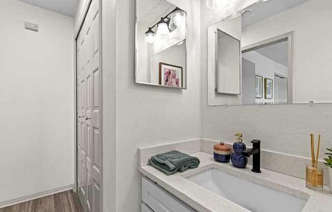 the bathroom of our studio apartment atrium with sink and mirror