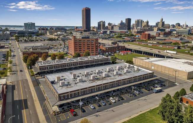 an aerial view of a large building with a city in the background at The Lofts at Elk Terminal, Buffalo, New York