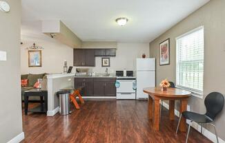a living room filled with furniture on top of a hard wood floor