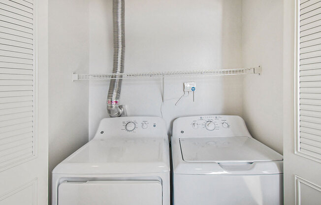 washer and dryer in the laundry room at Canal 2 Apartments, Lansing, Michigan