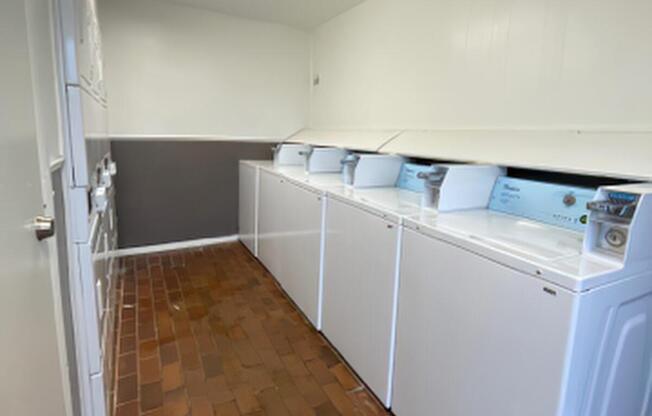 a kitchen with a sink and a refrigerator