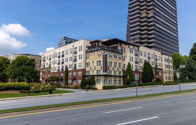 a view of an apartment building on a city street