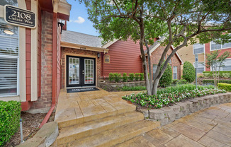 A red building with a sign that says 2108 Calistoga Way.