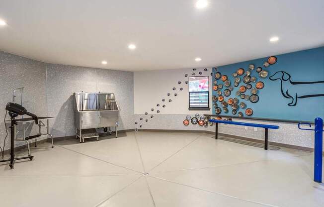 A room with a blue wall and a bench.