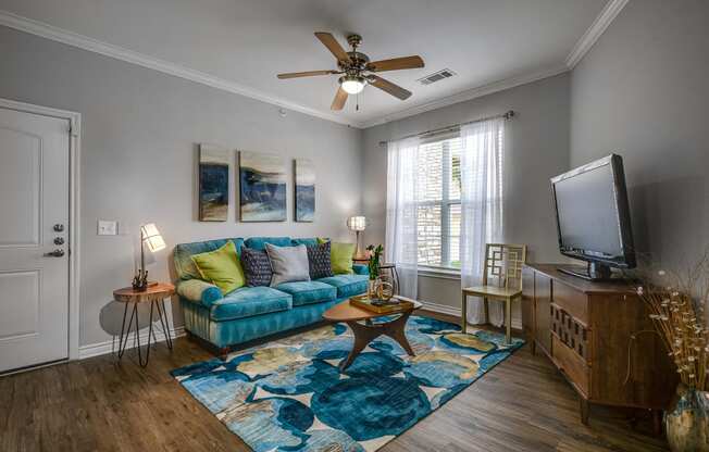 Living Room With Ceiling Fan at Riachi at One21, Plano, TX, 75025