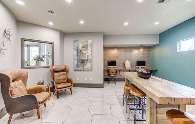 A room with a long wooden table and chairs.