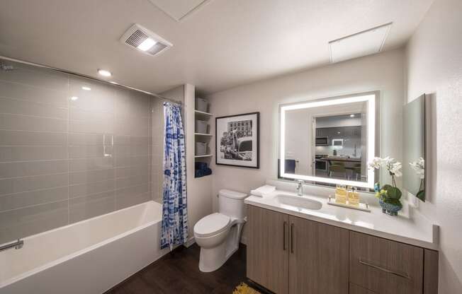 a bathroom with a shower toilet and sink