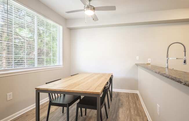 Lighted ceiling fans over dining area - Springbrook Apartments