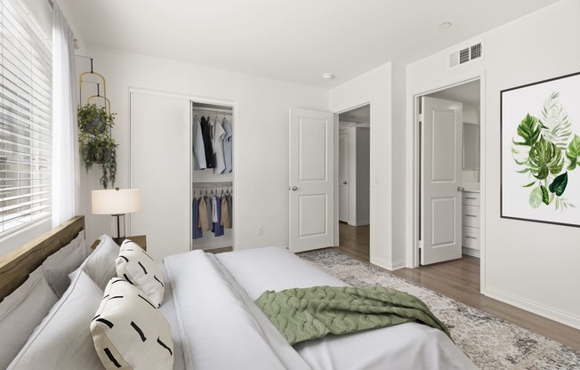 a bedroom with a large bed and a closet