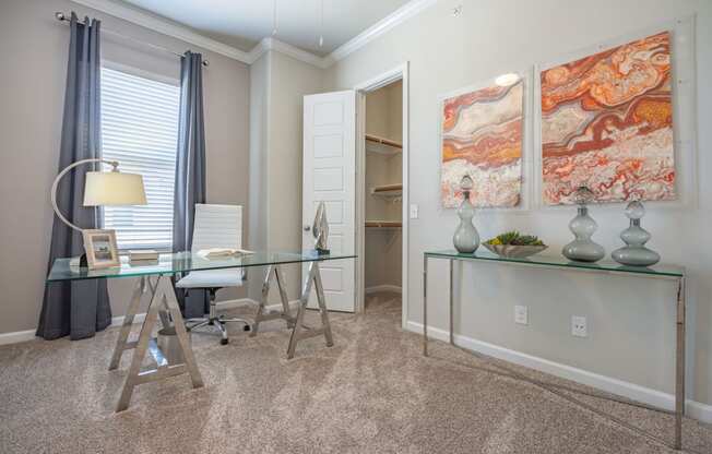 staged home office with walk-in closet and ceiling fan