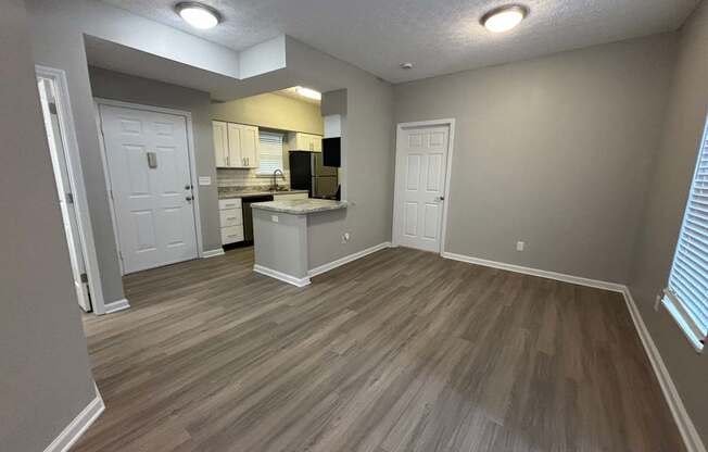 Fenwick Place Apartments in Louisville, KY 40220 - Living room looking into kitchen 2