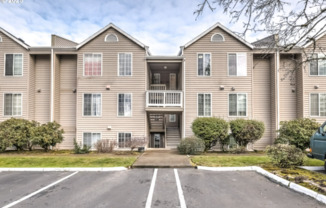 Updated Upper-Level Condo with Gas Fireplace, Balcony & Washer/Dryer