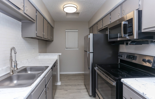 state of the art kitchen with black appliances