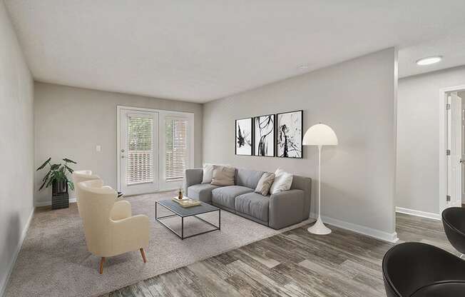 Model Living Room with Carpet and Patio Accessibility at Retreat at Stonecrest Apartments located in Lithonia, GA.