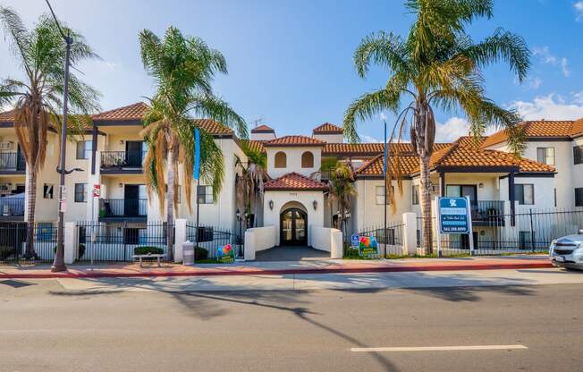 a building with palm trees in front of it