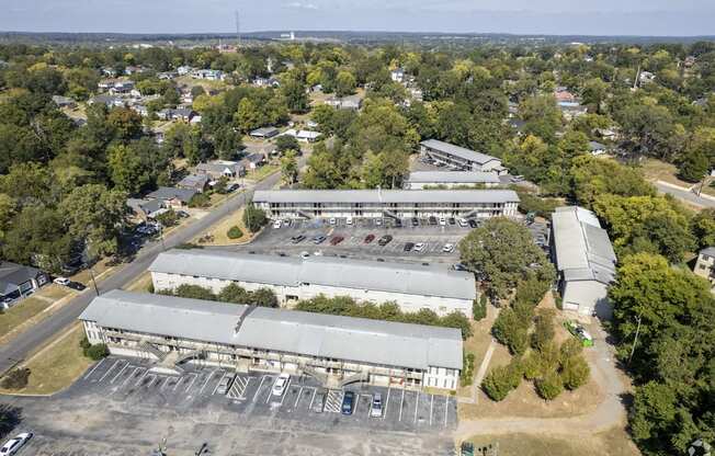 an aerial view of a large industrial building with a parking lot