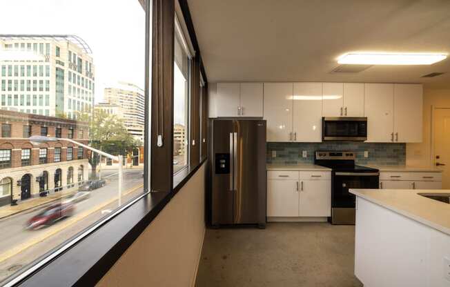 a kitchen with a window and a city view at The Lady, South Carolina, 29201