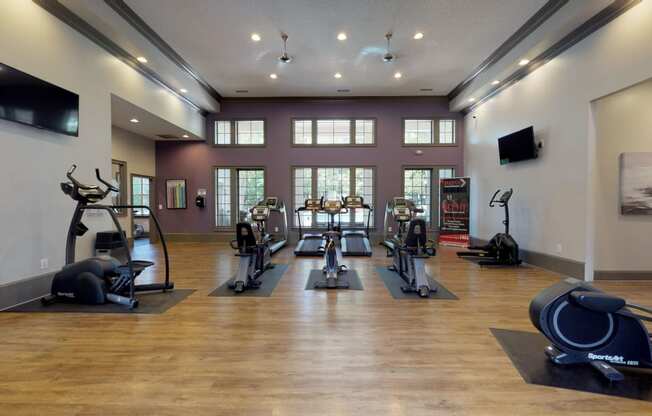 a gym with treadmills and other exercise equipment at Autumn Park Apartments, Charlotte, North Carolina