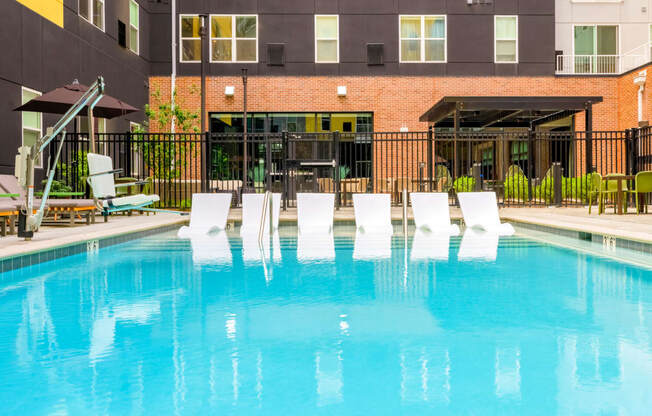 Swimming pool with in-pool loungers